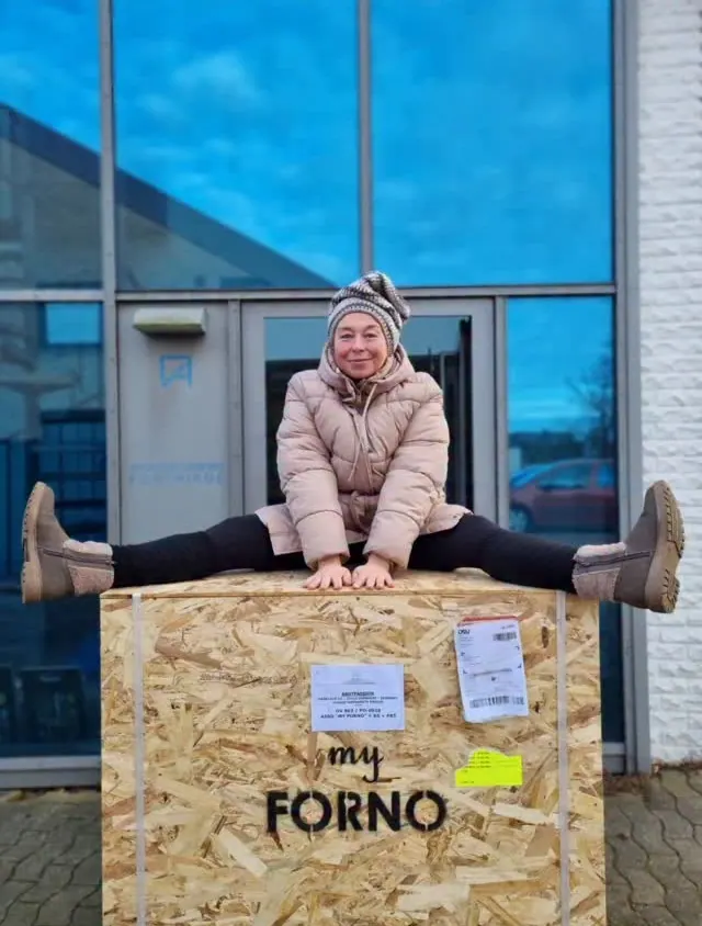 Imagina von Rosenberg sitting on her MyForno oven crate